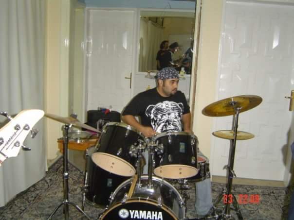 Playing drums in rock band